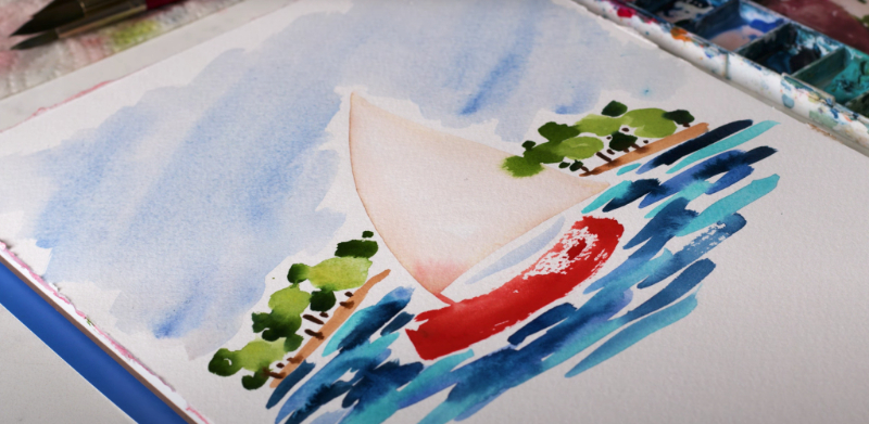 A watercolor painting of a red sailboat gliding across blue waves with green trees along the shore. The loose brushwork and soft sky capture the breezy, sunlit feeling of watercolor beach scenes and coastal landscapes.