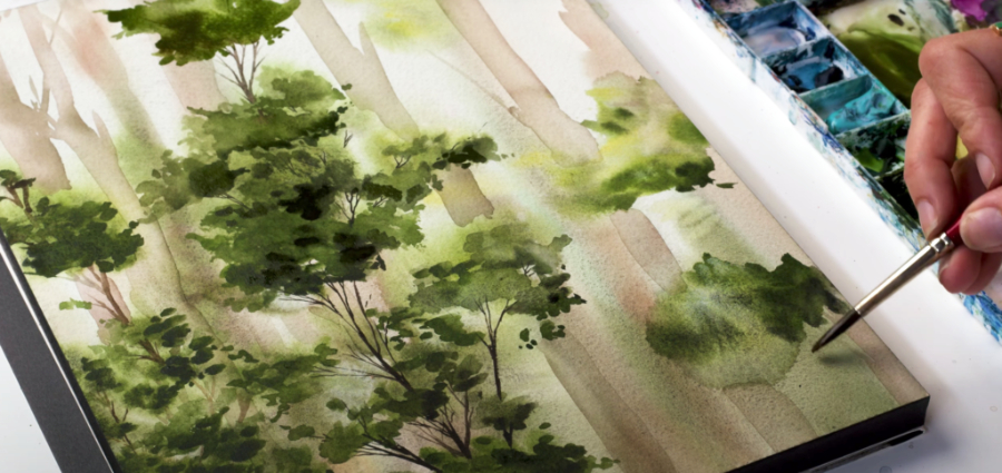 Close-up of a soft, layered forest watercolor painting with delicate trees and diffused light. Gentle washes and blending demonstrate watercolor-painting-background techniques that create depth, atmosphere, and a dreamy, natural landscape feel.